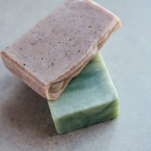 Close-up of two organic handmade soap bars, showcasing natural textures and colors.